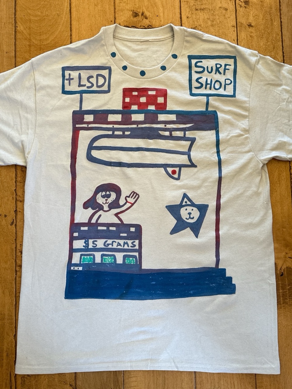 Graphic Surf Shop T‑Shirt in Off-White with Blue & Red Art